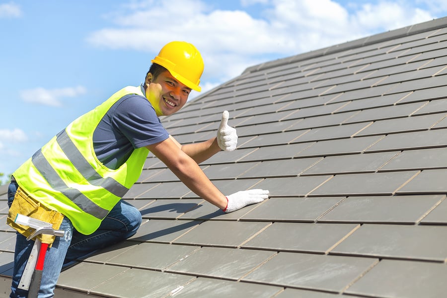 Professional roofing contractor at work